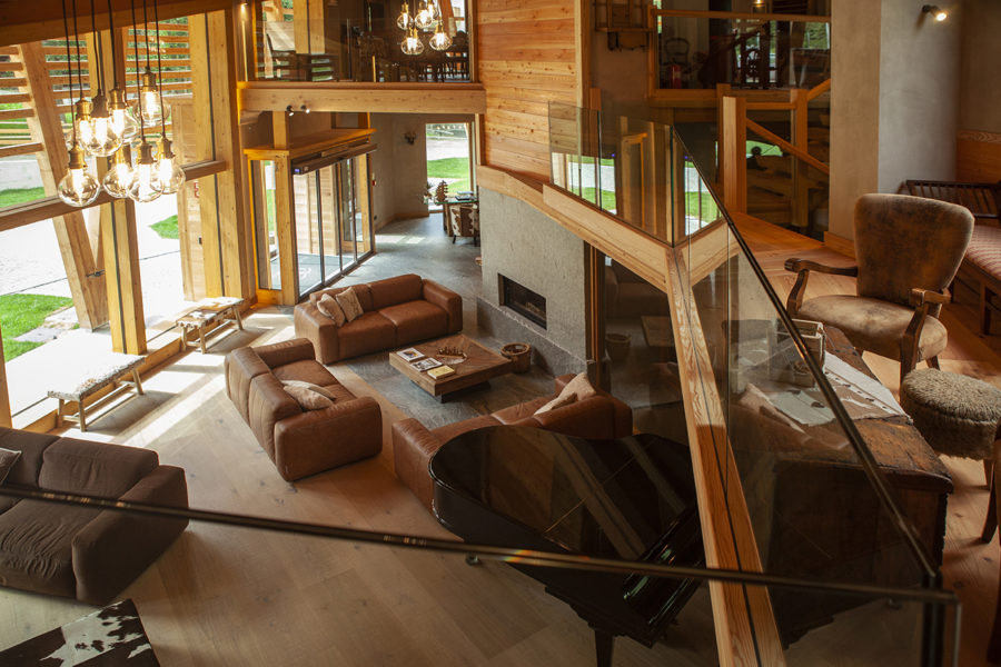 Hotel Charmant petit Lac wood modern interior design. Ski resort. Luxury chalet. You can enjoy the spirit-lifting vistas and sybaritic pleasures of an alpine holiday without taking a toll on nature. Here's how...