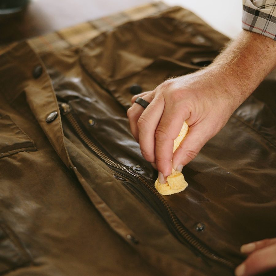 Hand rewaxing a jacket