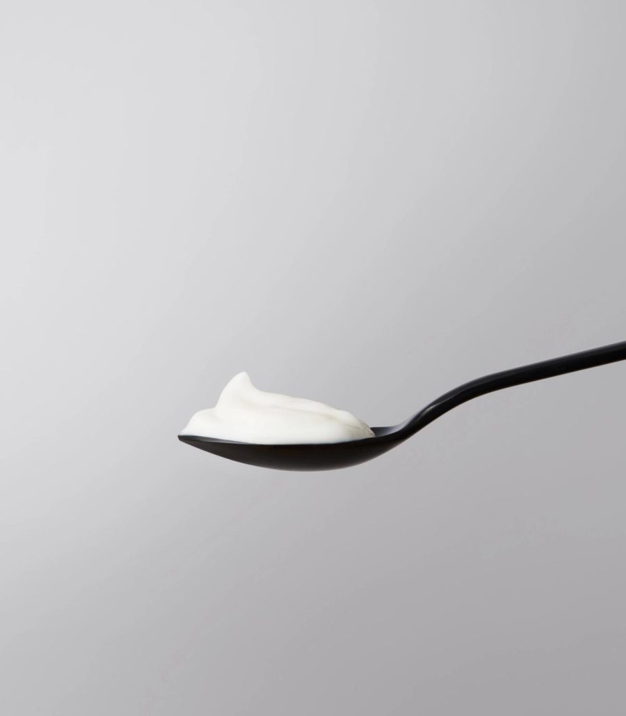 Night cream bottle in spoon