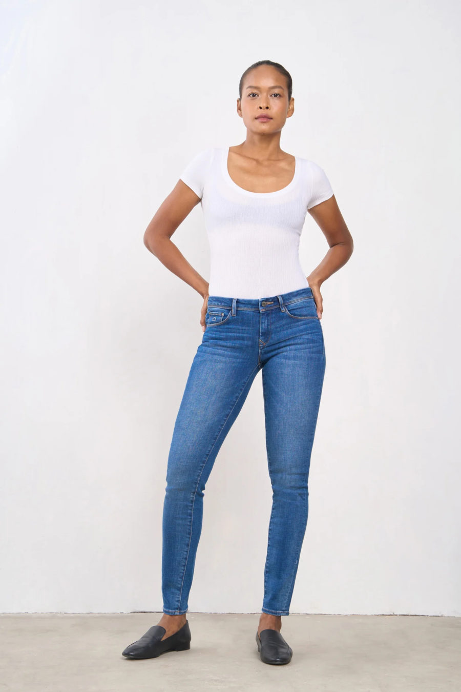 woman wearing jeans and white t-shirt