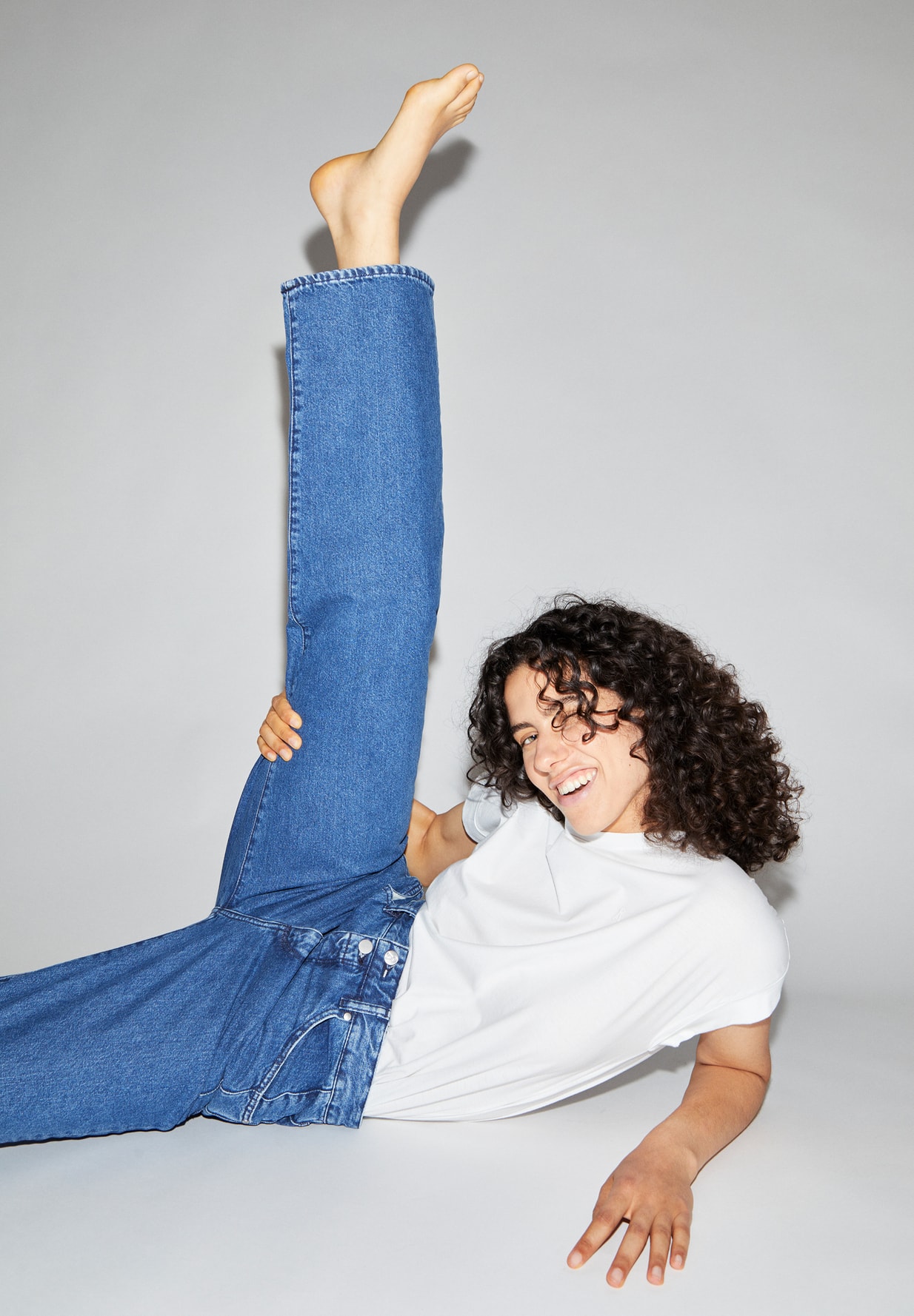 woman wearing jeans and white t-shirt