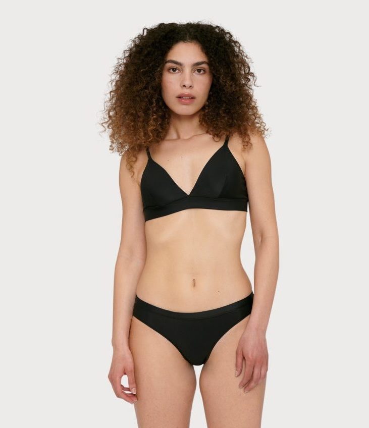 Make your summer closet more sustainable with these consciously made swimsuits and bikinis that have our Calendar seal of approval Organic Basics